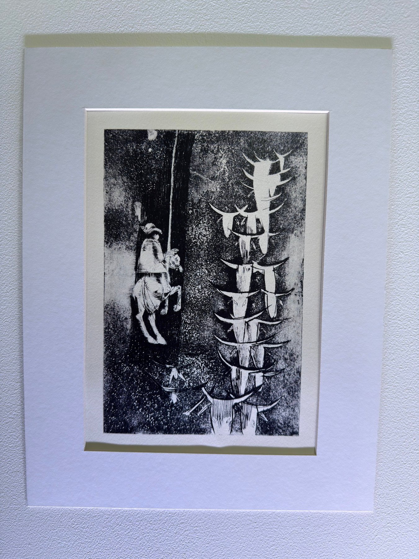 Gravura de vaqueiro e crânios de boi